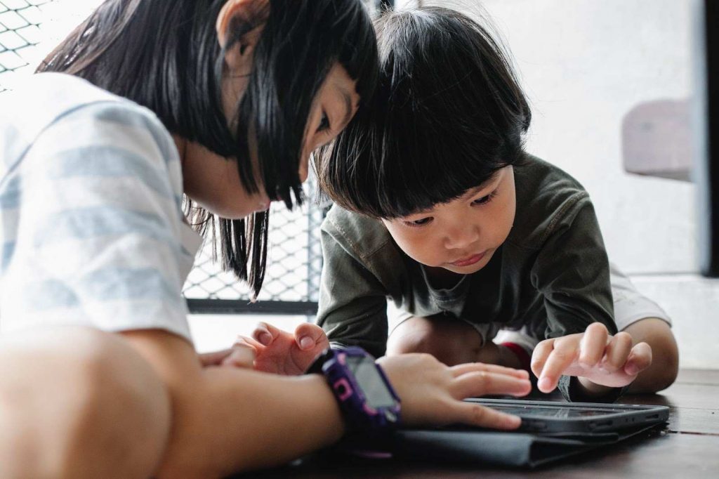 Children playing on a tablet