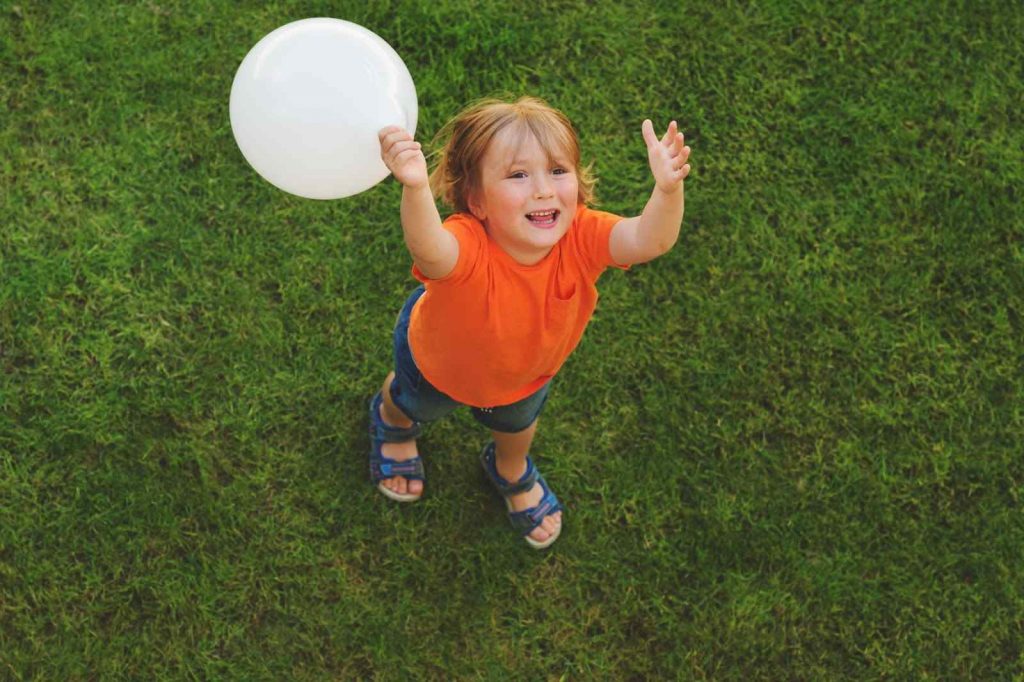 A toddler with balloon