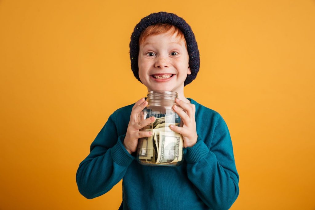 A kid with a money jar