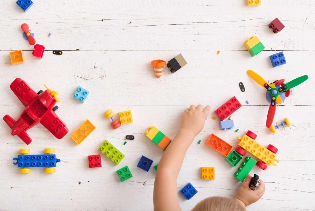 Kid playing with Lego