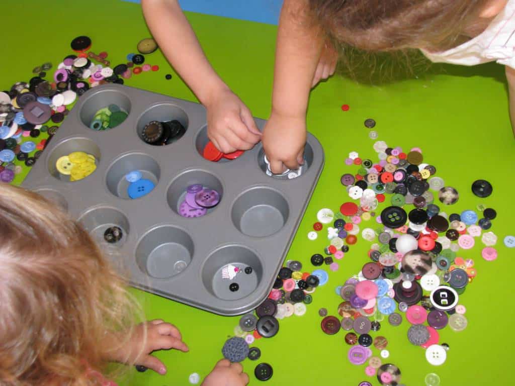 Kids sorting buttons