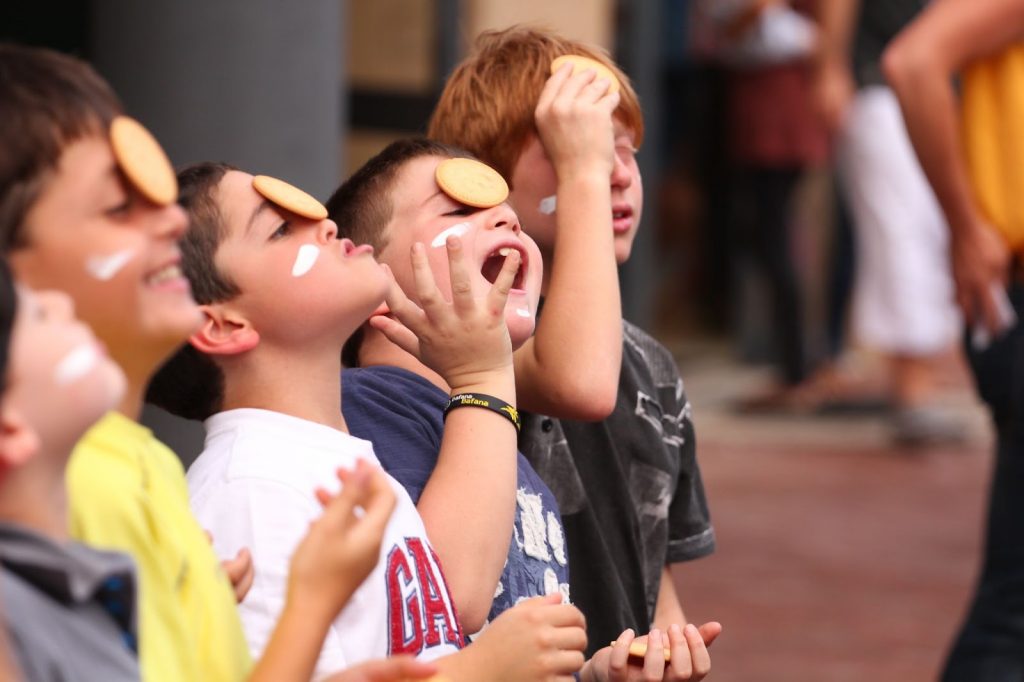 Kids with cookie on their face