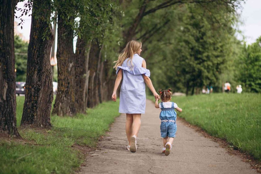 Mother walking in the park with a child