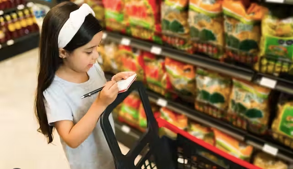 A girl checking a grocery list