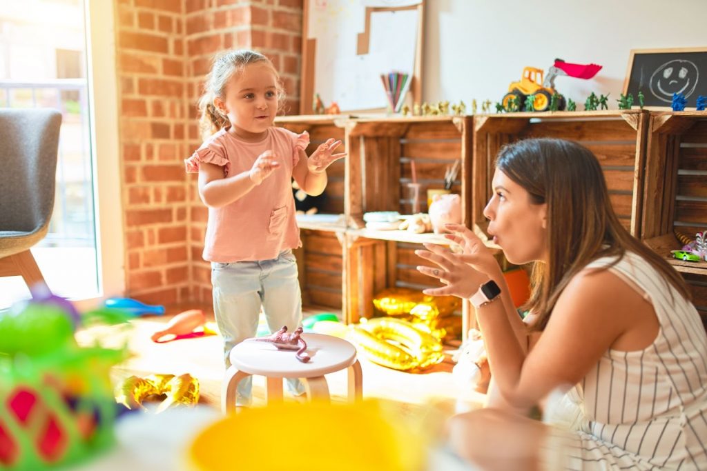 Kid with mother playing charades