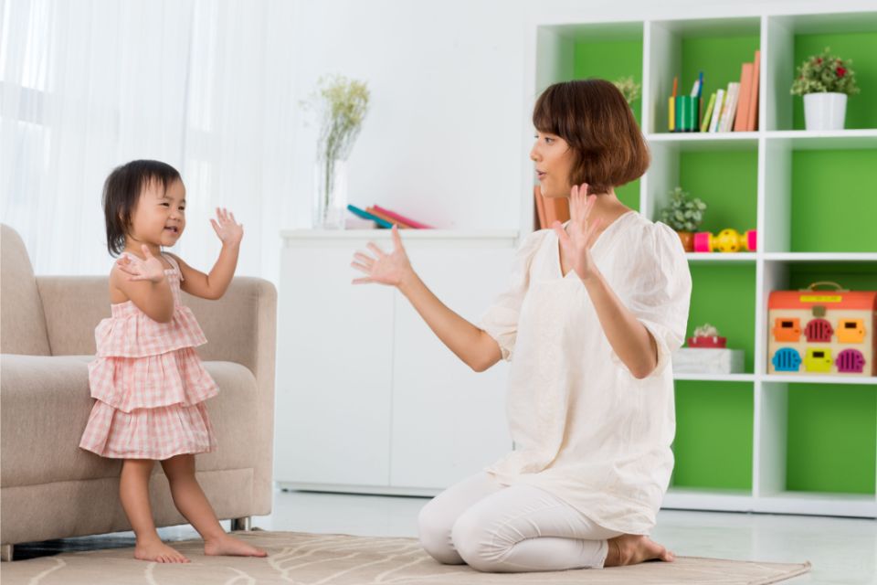 Mother and kid doing freeze dance