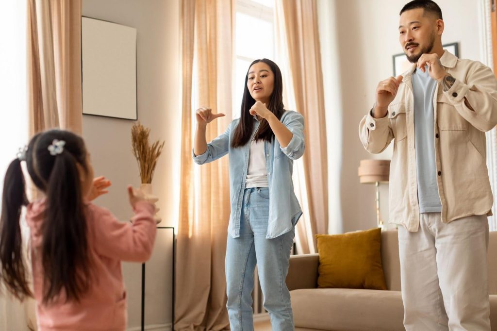 Parents playing charades with kid