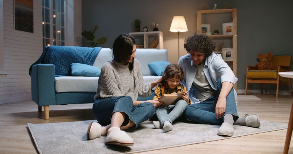 Parents and kid reading together