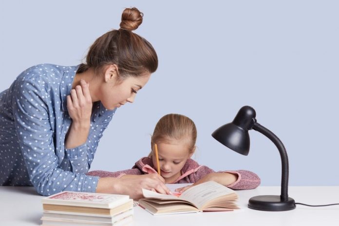 Mother teaching daughter