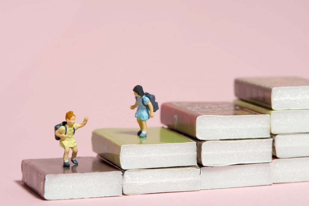 Miniature toys on books
