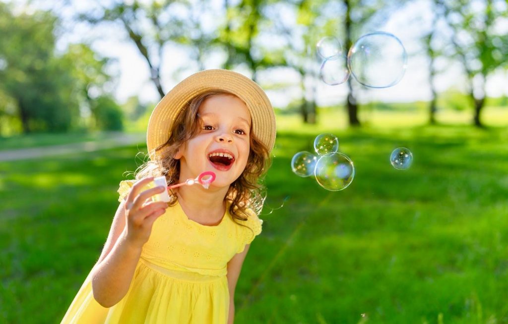 Kid blowing bubbles