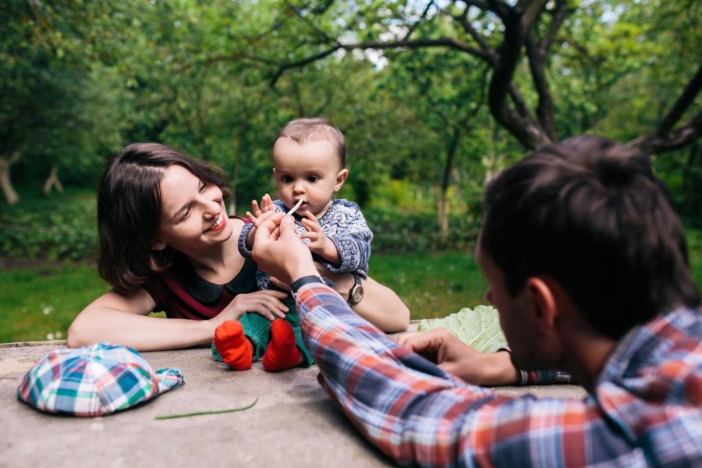 Toddler with parents in park