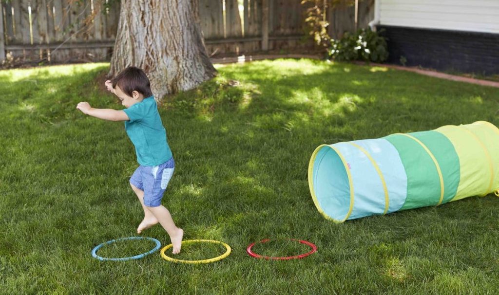 Kid playing obstacle course