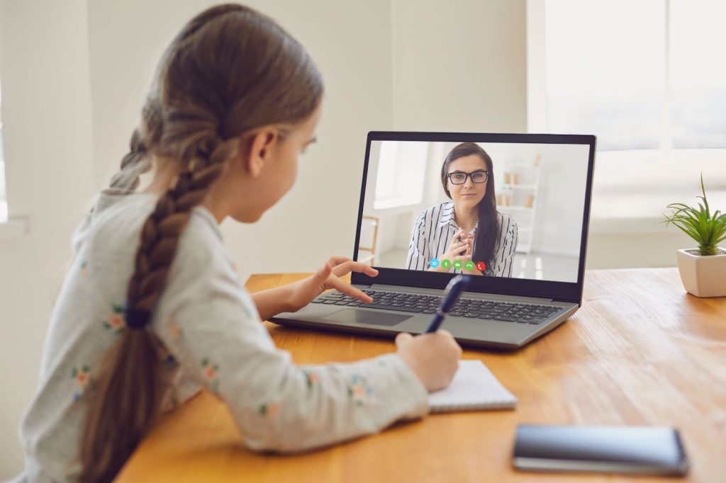A student on a video call with teacher