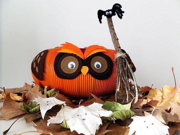 A halloween themed owl made out of pumpkin