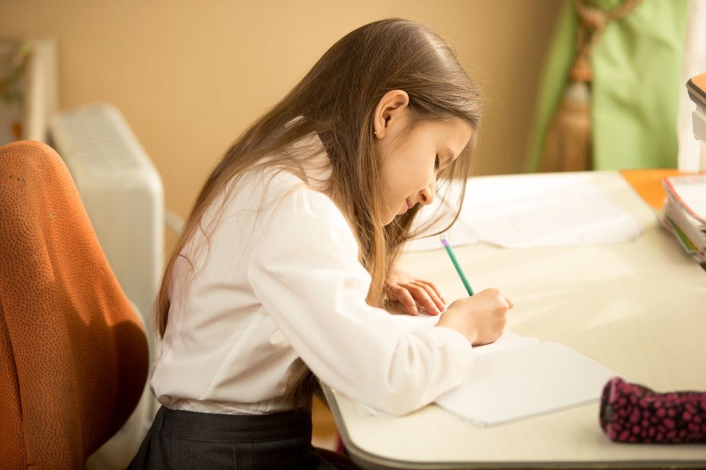 A girl writing a letter