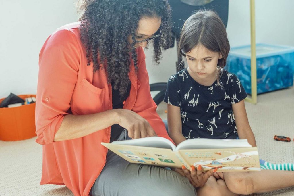 Mother showing pictures to her kid