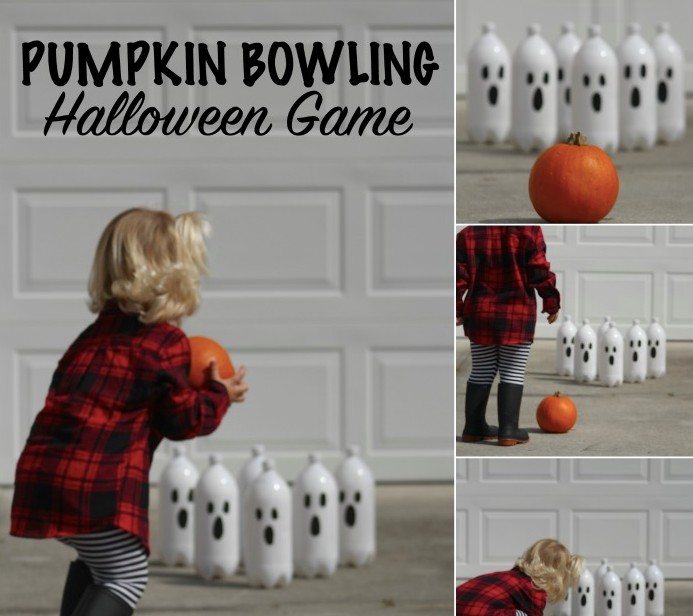 A little girl playing halloween pumpkin bowling game