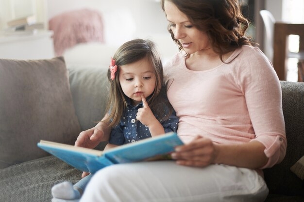 Mother Reading a Storybook to Her Child