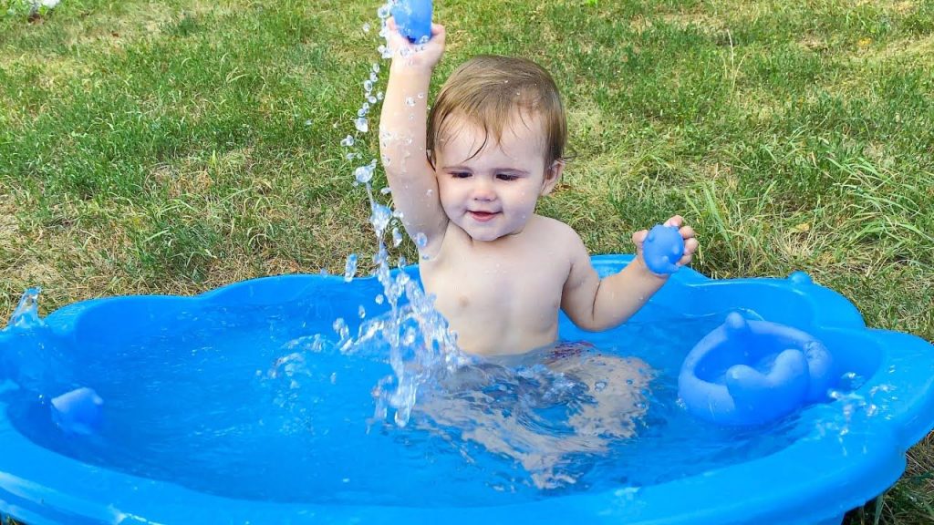 Toddler in a baby pool
