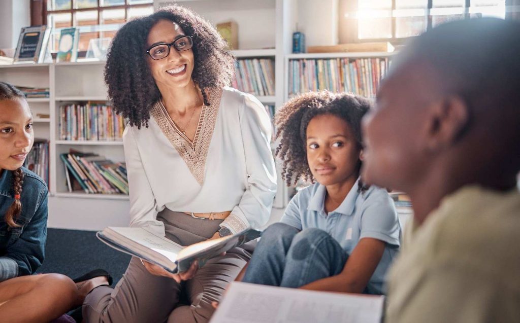 Teacher with kids reading stories