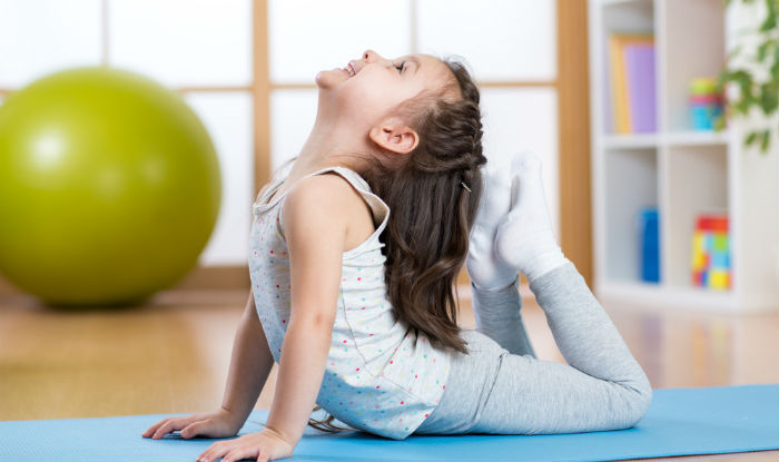 Kid doing yoga