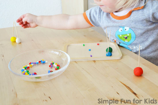 Colorful beads being sorted and counted by a child