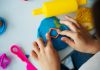 20 Best Hand-On Activities for Kids: Engaging Little Hands Kid using playdough for craft