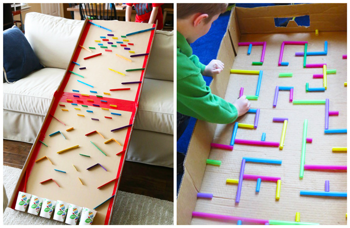 Kid playing with a DIY marble run