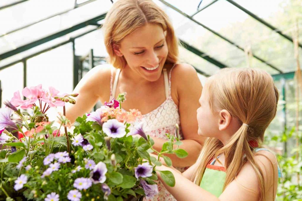 Daughter and mother gardening