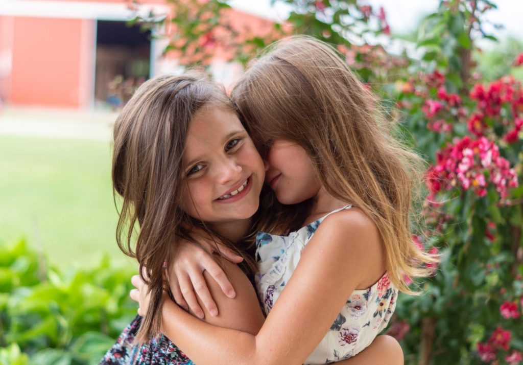 Two girls wishing each other