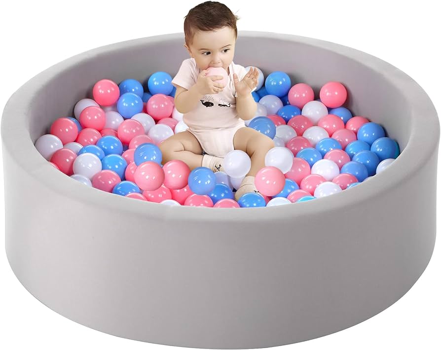 A toddler in a ball pit