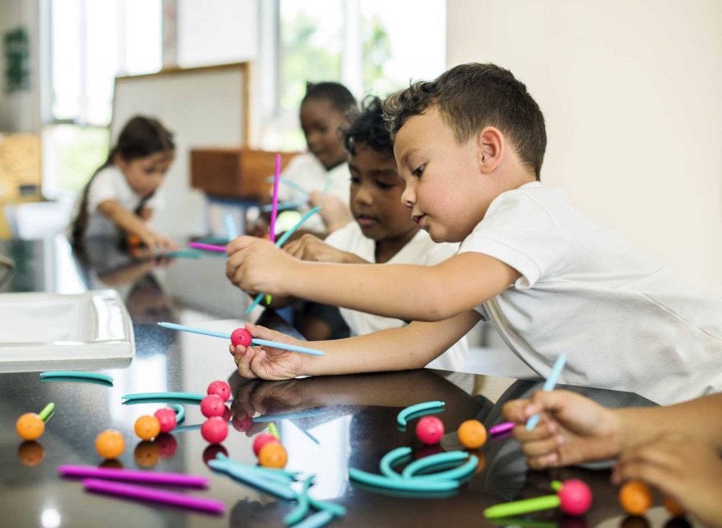 Kids doing hands on activities in class