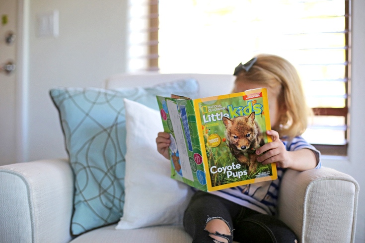 A girl reading a magazine