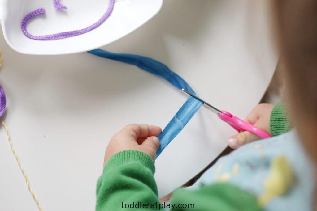 A girl cutting ribbon