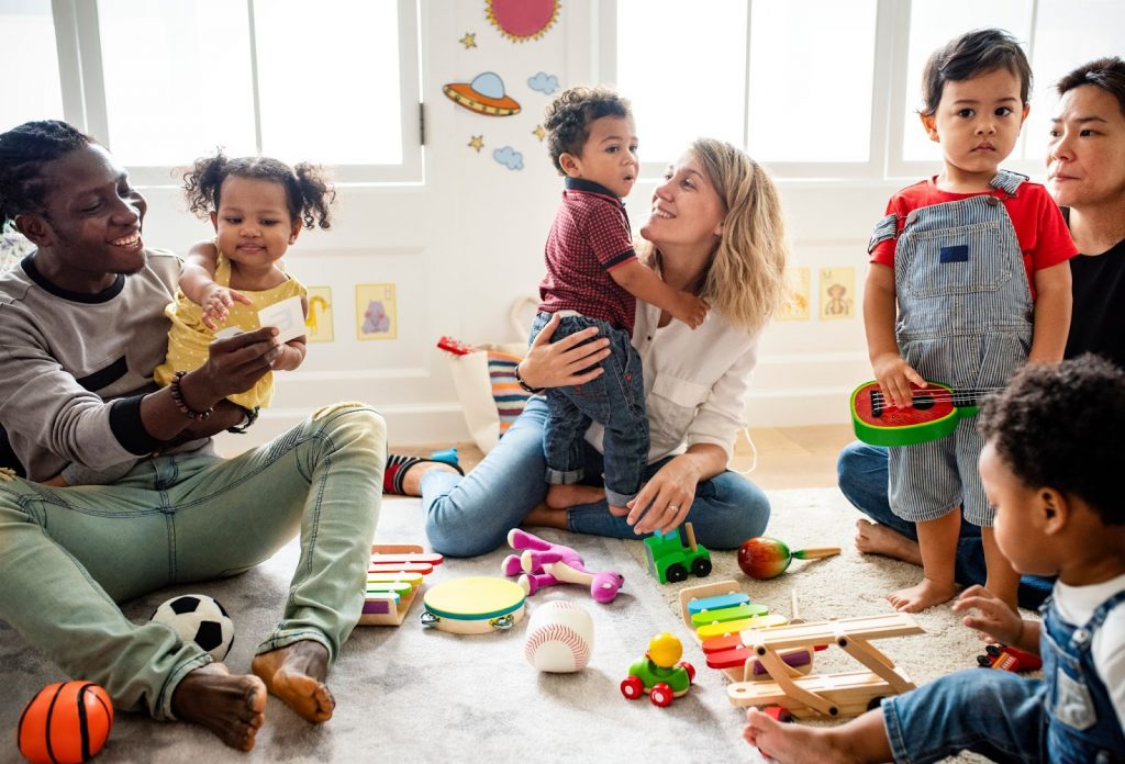 Toddler and parents playing on a playdate