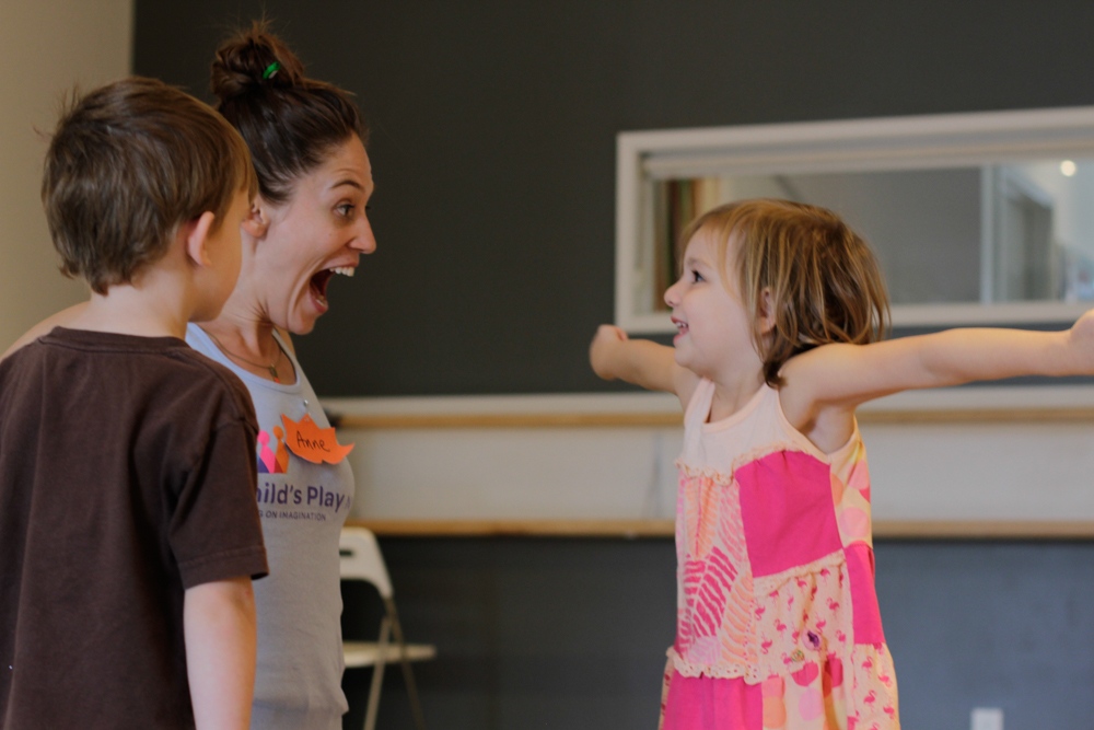 Daughter enacting in charades