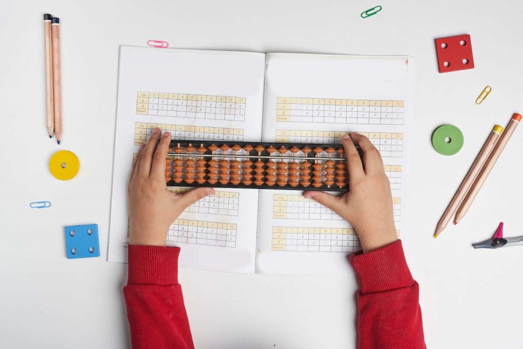 A kid using abacus