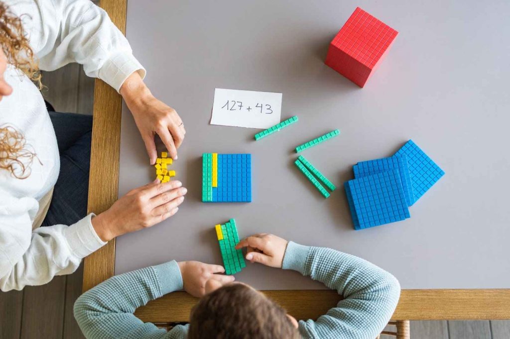 kids using base ten blocks