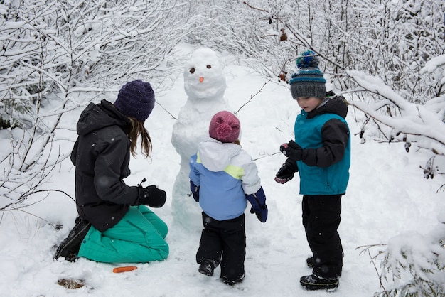 Kids building a snowman