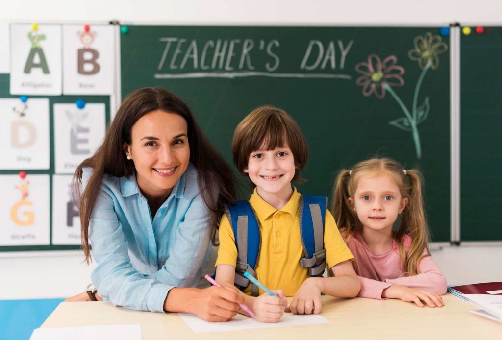 Teacher helping students in a classroom