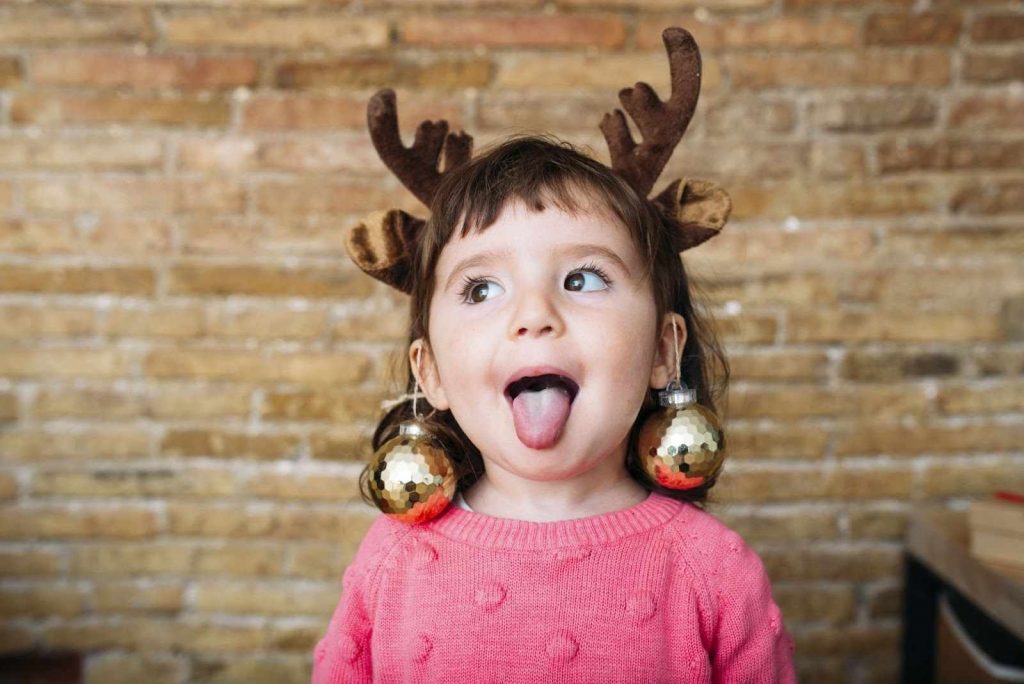 A girl with reindeer headband