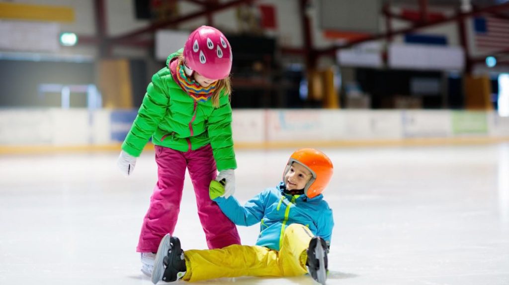 Two kids ice skating