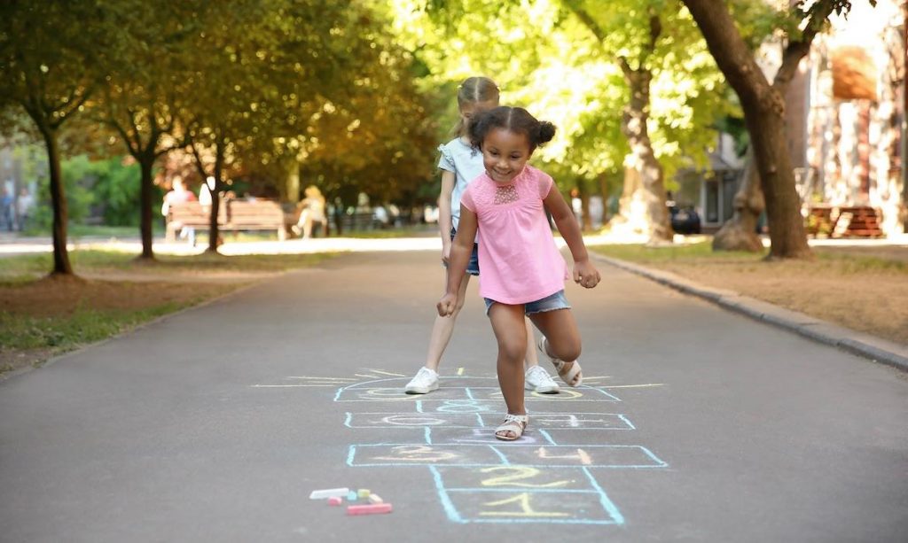 Kids jumping on hopscotch