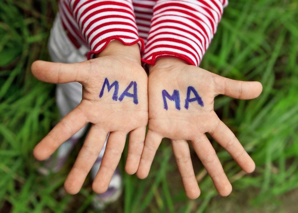 Ma Ma written on kids palms