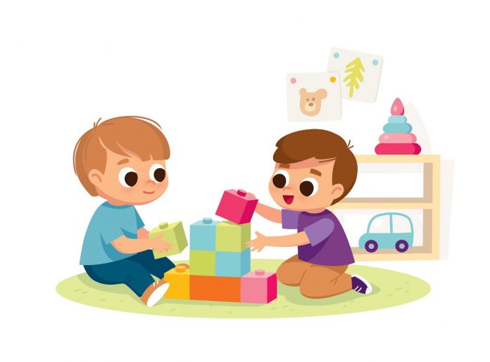 Two kids playing with lego blocks