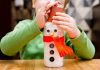 Kid making a snowman craft