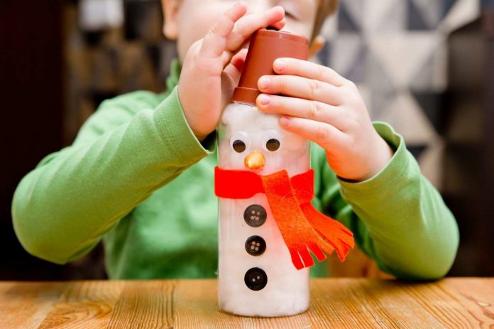 Kid making a snowman craft