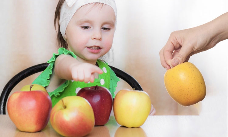 Kid counting fruits