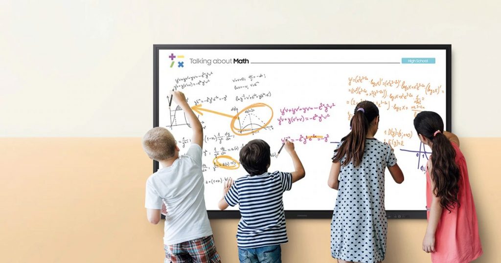 Kids writing on whiteboards